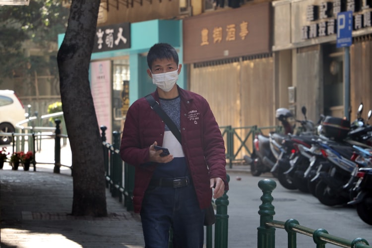 a mask-wearing man in Macau